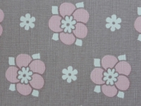 pink flower with white dots on a grey background
