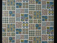 Vintage floral wallpaper with small blue and pink flowers