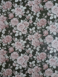 Vintage floral wallpaper with pink flowers on a green background