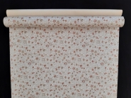 Papier peint vintage avec fleurs beige et rose sur un fond de liège